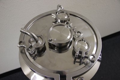 12" Lid with (3) 1.5" ports and (1) 3" port. 